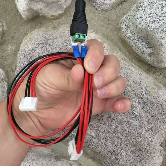 5V barrel adapter connected to LED panel power cable