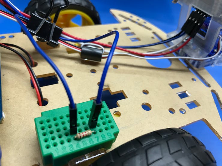 Mini breadboard used to connect the resistor for the Echo jumpers