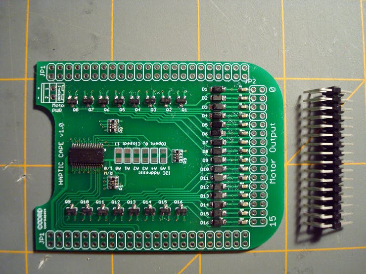 To attach our (max 16) tactors to the board, a 2x16 right-angle male header assembly is attached to the underside of the PCB.