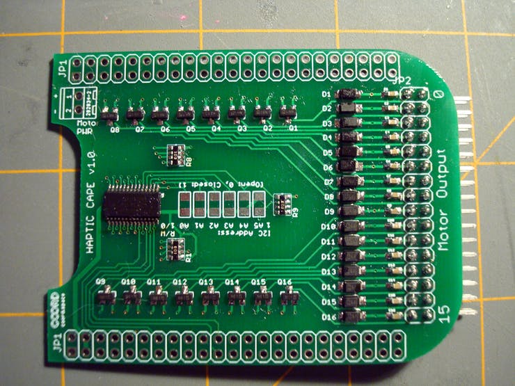 Here's what the board should look like after soldering the motor output header into place. Just a little bit more!