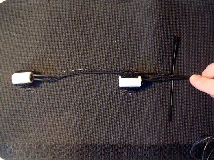 Using small zip ties, bundle together all the wires about an inch under each tactor. Progressing from the outer-most tactor inwards.