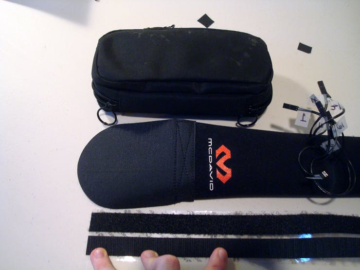 To attach the case that holds all the electronics, cut three more velcro strips about the length of the case.