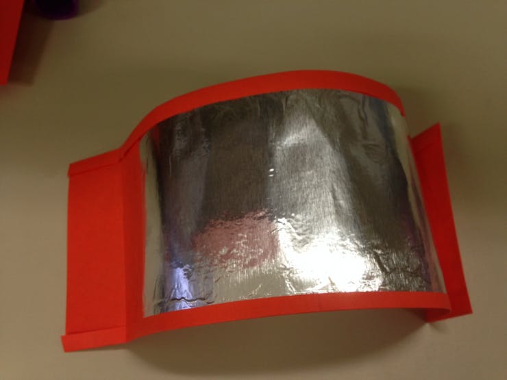 This is the cuff after the foil was glued on and the paper was folded, right before I tape on the wire.